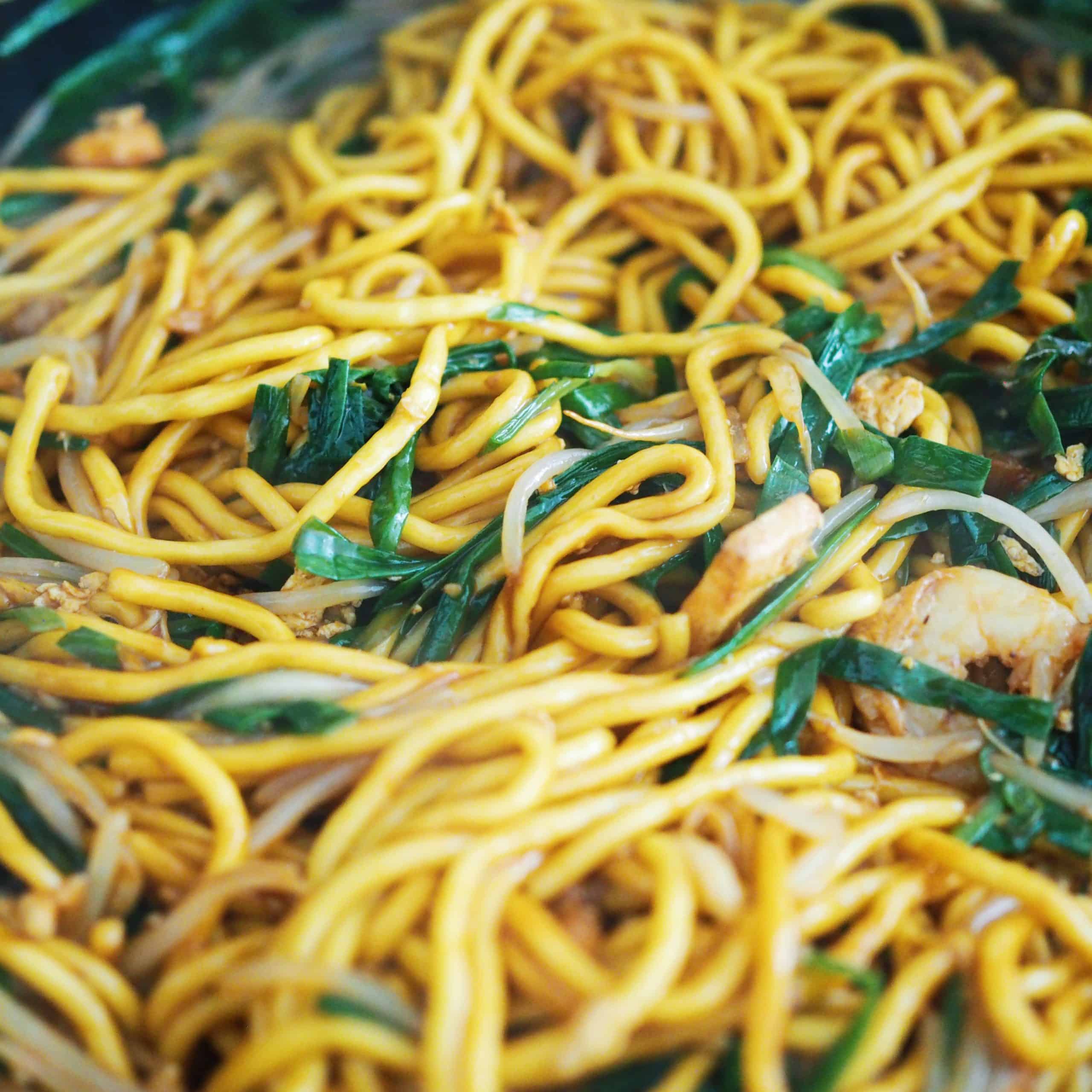 Toss in noodles with noodle sauce until it's incorporated with the other ingredients. Remove pan off heat and transfer noodles to a large serving plate and enjoy!