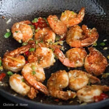Quickly add in garlic, red chili, ginger, green onion, sugar and shaoxing wine as the last ingredient. Stir fry everything together until the wine has evaporated. Finally remove off heat. Serve immediately and enjoy!