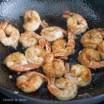 Heat vegetable oil in a large pan on medium heat. Fry shrimp on both sides until mostly pink and crispy, flipping over half way, about 2-3 minutes in total.
