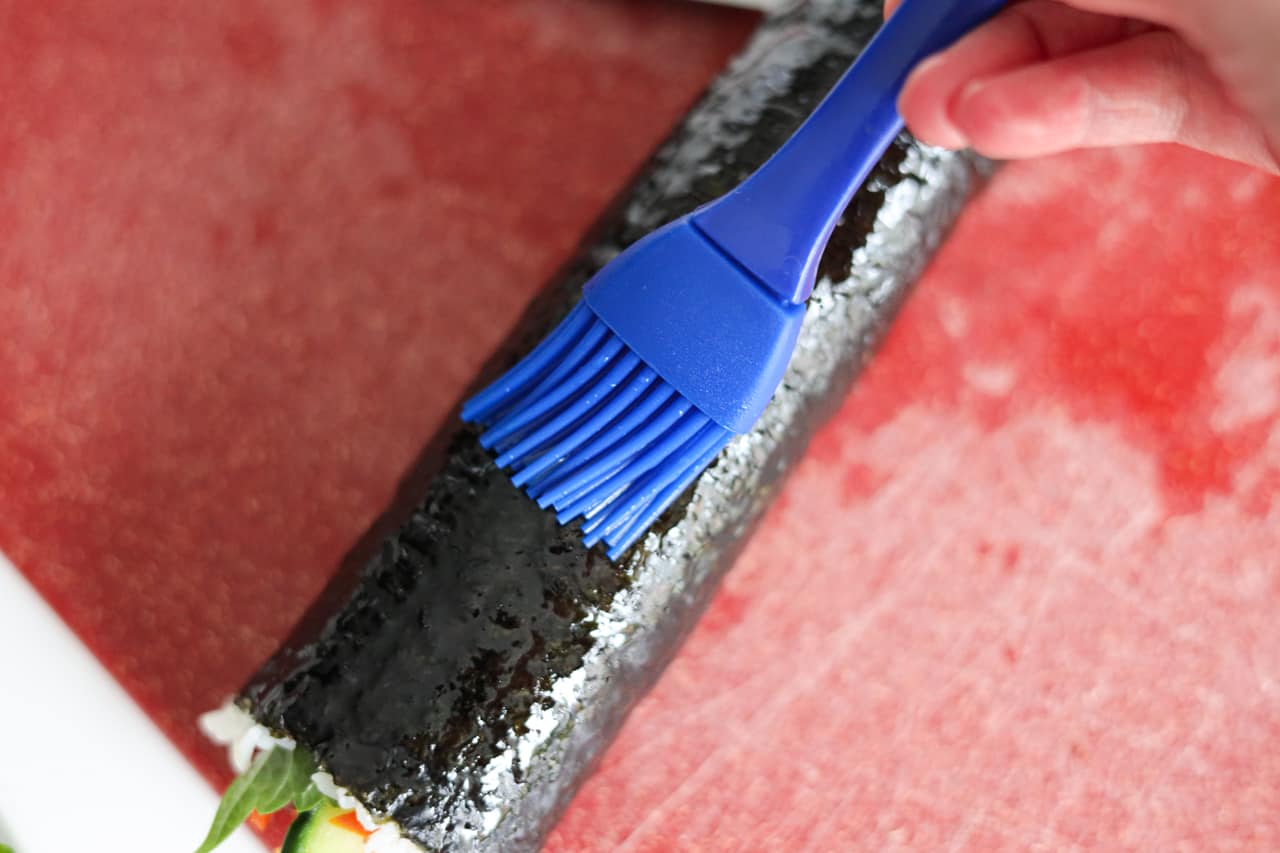 brush kimbap with sesame oil