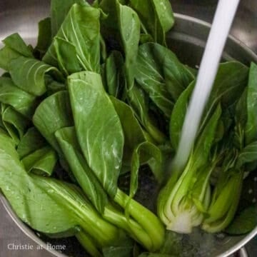 Bok choy halves rinsed thoroughly under cold running water until clean.