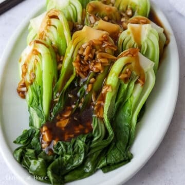 Thickened garlic sauce poured over the blanched bok choy.