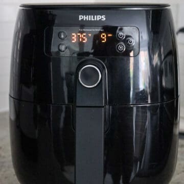 Air fryer cooking soy sauce chicken thighs at 375°F (190°C) for 8-10 minutes.