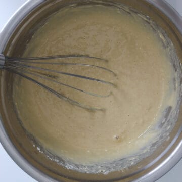 Yeast mixture, eggs, and vanilla extract mixed into the dry ingredients.