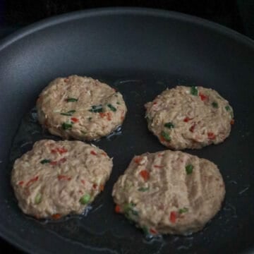 In a non stick frying pan on medium heat, add oil and add one tuna ball at a time and flatten it out into a ½-inch-thick pancake with a spatula