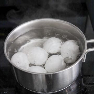 Eggs boiling in water for Korean mayak eggs.