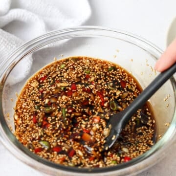 Soy marinade mixed with onion, garlic, green onion, chilies, and sesame seeds.