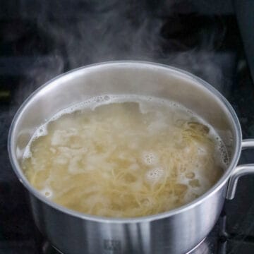 Heat a large pot of boiling water on high heat, add fresh wonton noodles. Loosen noodles and blanch for 10 seconds or just until al dente. Do not over blanch them! Immediately strain and transfer to a large serving bowl. Optional: Feel free to rinse the hot noodles in cold running water to shock them and to stop the cooking process but make sure to shake out as much excess water as possible.