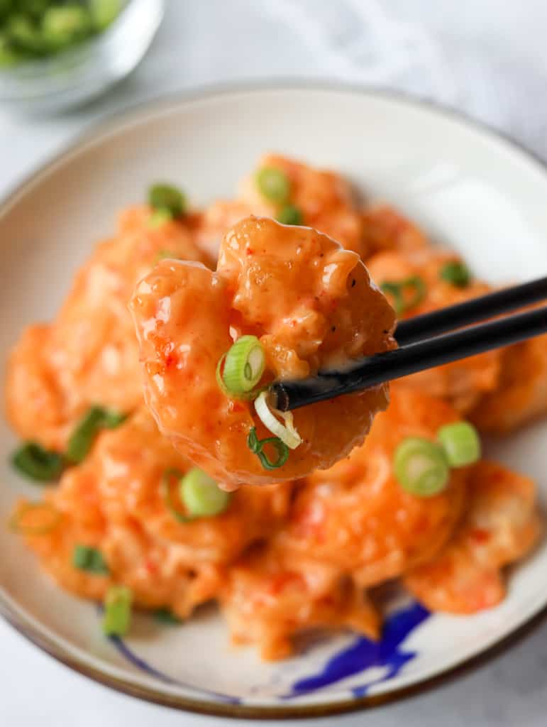 image of bang bang shrimp being held by chopsticks