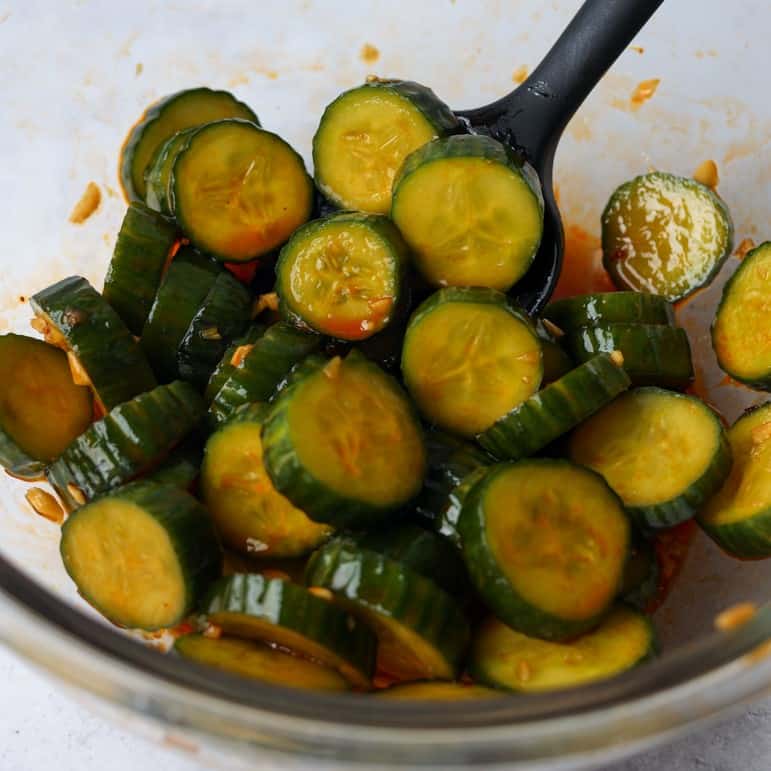 Pour dressing over cucumbers. Mix well. Enjoy!