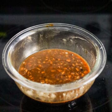 A uniform mixture of dark brown soy sauces, oils, and starch liquids.
