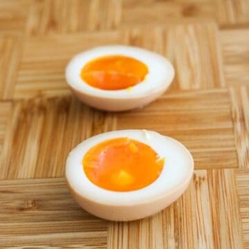 Ramen egg sliced in half with a jammy yolk.