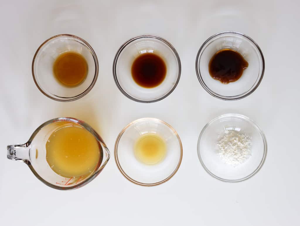 Gravy ingredients for egg foo young including oyster sauce, soy sauce, shaoxing wine, chicken stock, sesame oil, and cornstarch.