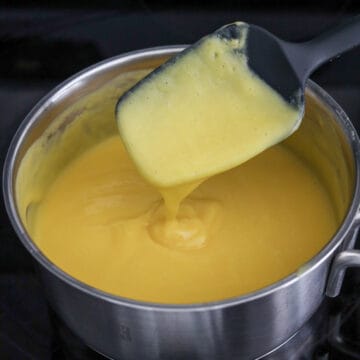 Mango pudding mixture gently heated until the gelatin fully dissolves.