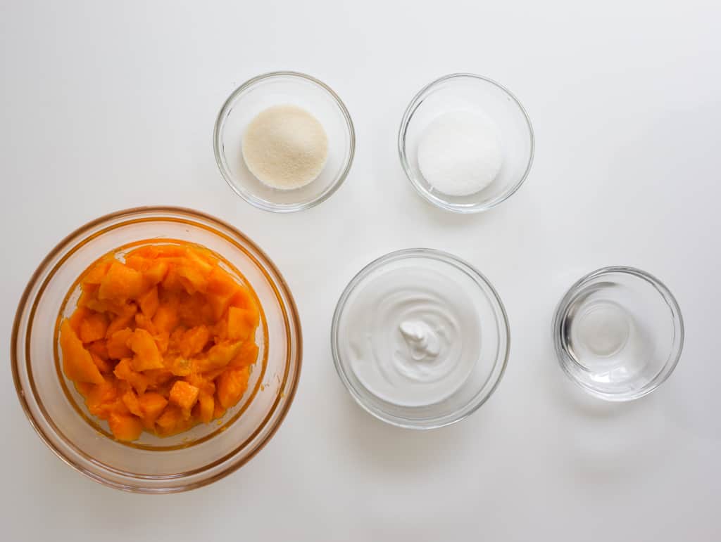 Mangos, coconut milk, gelatin powder, sugar, water, and evaporated milk for mango pudding.