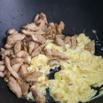 Pour in beaten eggs. Cook and scramble them. Move to the side of the pan.
