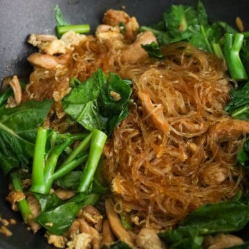 Toss in Chinese broccoli, noodles, and stir-fry sauce and cook until noodles are well coated in sauce and greens have softened.