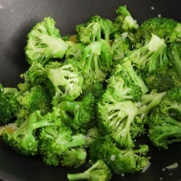 Broccoli florets stir-fried with garlic and ginger until bright green.