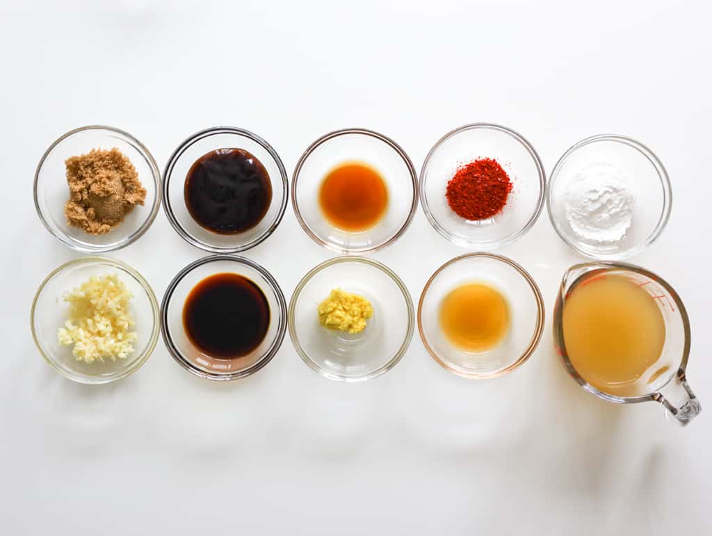 Garlic, brown sugar, soy sauce, hoisin sauce, ginger, sesame oil, Shaoxing wine, cornstarch, red pepper flakes, and chicken broth to make ginger chicken sauce.