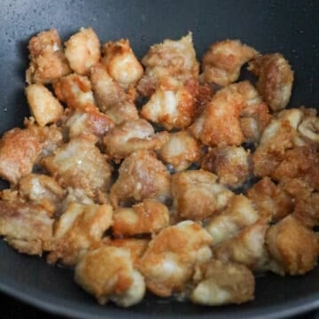 Golden brown fried chicken pieces with a crisp, textured exterior.