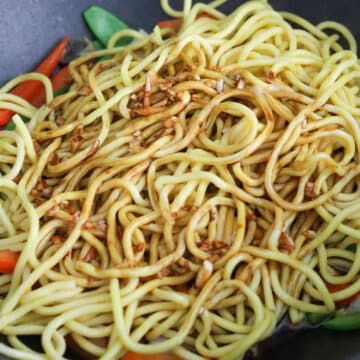Lo mein noodles added to crisp-tender stir-fried vegetables.
