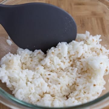 Hot cooked rice mixed with toasted sesame oil, sesame seeds, and salt.