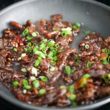 Crispy Mongolian beef tossed in sauce with green onions and sesame seeds.