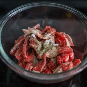 Thinly sliced beef coated in marinade.