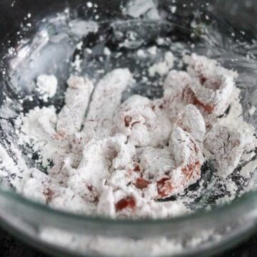 Marinated beef slices evenly coated in cornstarch.