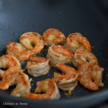 Shrimp seared until pink and lightly curled.