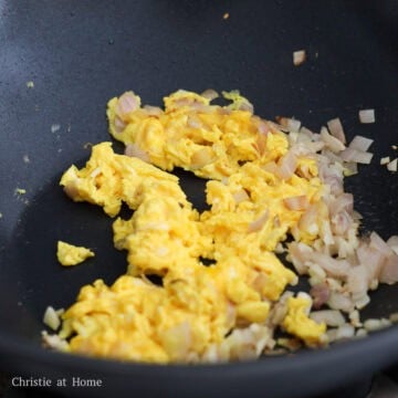 Shallots, garlic, and scrambled eggs cooking together.