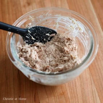 Open a can of tuna and strain the tuna using a fine sieve removing as much of the liquids as possible by pressing it with a fork. Transfer the strained tuna to a small bowl. Mix in the Japanese mayo until combined. Set aside.