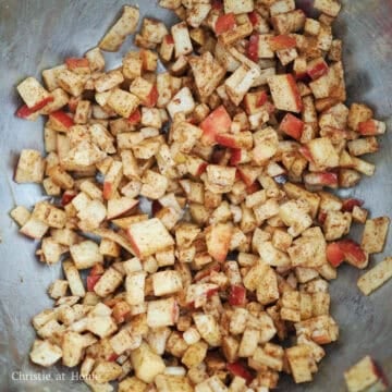 Transfer finely diced apples into a large mixing bowl. Add sugar, nutmeg, cinnamon, cornstarch and mix well.