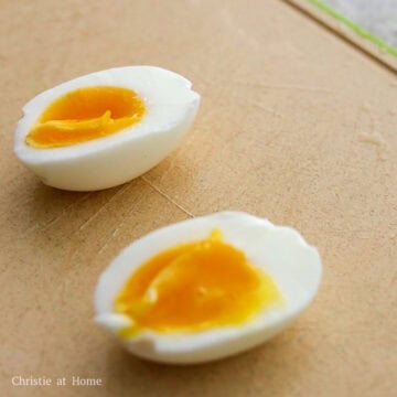 Crack and peel egg then slice in half