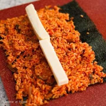 Place a strip of mozzarella cheese in the center of the fried rice.