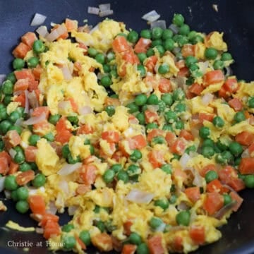 Beaten eggs scrambled into bite-sized pieces with the vegetables.