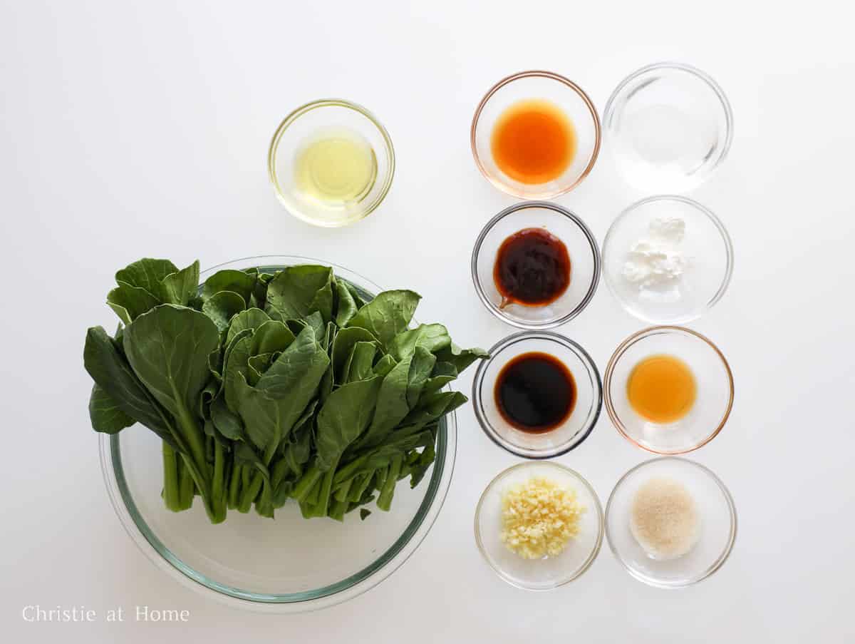 Ingredients for Chinese garlic yu choy including yu choy, garlic, soy sauce, oyster sauce, Shaoxing wine, sesame oil, and cornstarch.