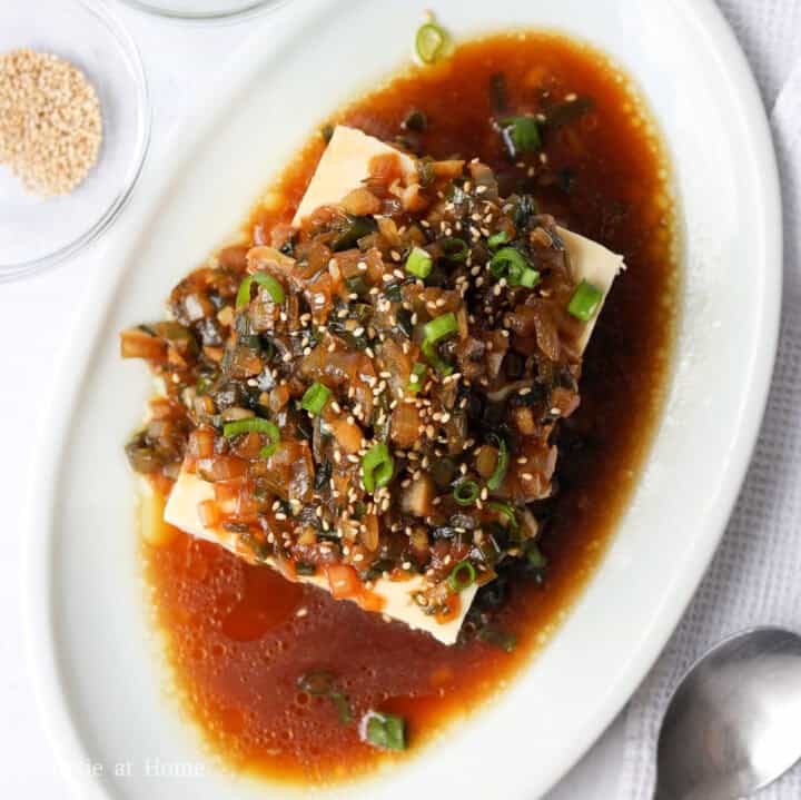 Chilled silken tofu topped with warm sesame soy onion sauce and toasted sesame seeds.