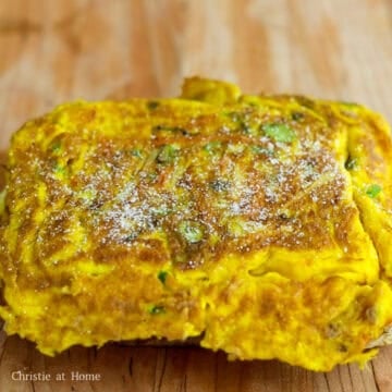 Fry the omelette on the other side until golden. Remove and place omelette on top of a slice of toast. Sprinkle sugar on top of the omelette.
