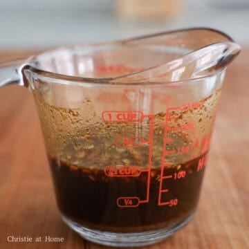 Smooth, dark savory stir-fry sauce mixture with visible ground spices.
