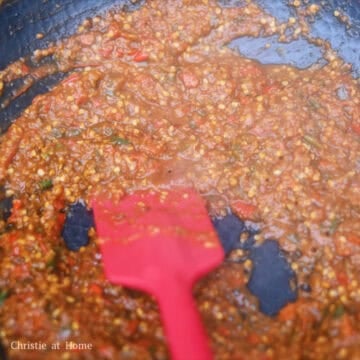 Next pour the ingredients back into the pan. For the next part, I strongly recommend turning on the stove fan on high or consider cooking the paste outdoors on a portable stovetop because it's very spicy and will cause you to cough uncontrollably.