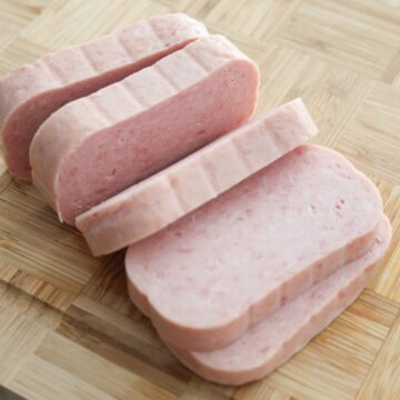 Five evenly sliced pieces of spam.
