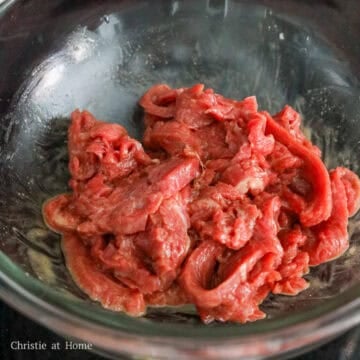 Thinly sliced beef coated in marinade.