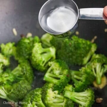 Broccoli florets stir-fried with ginger and garlic until bright green.
