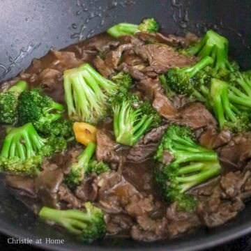 Beef and broccoli coated in a thick, glossy stir-fry sauce.