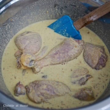 Marinated chicken drumsticks evenly coated in wet starch batter.