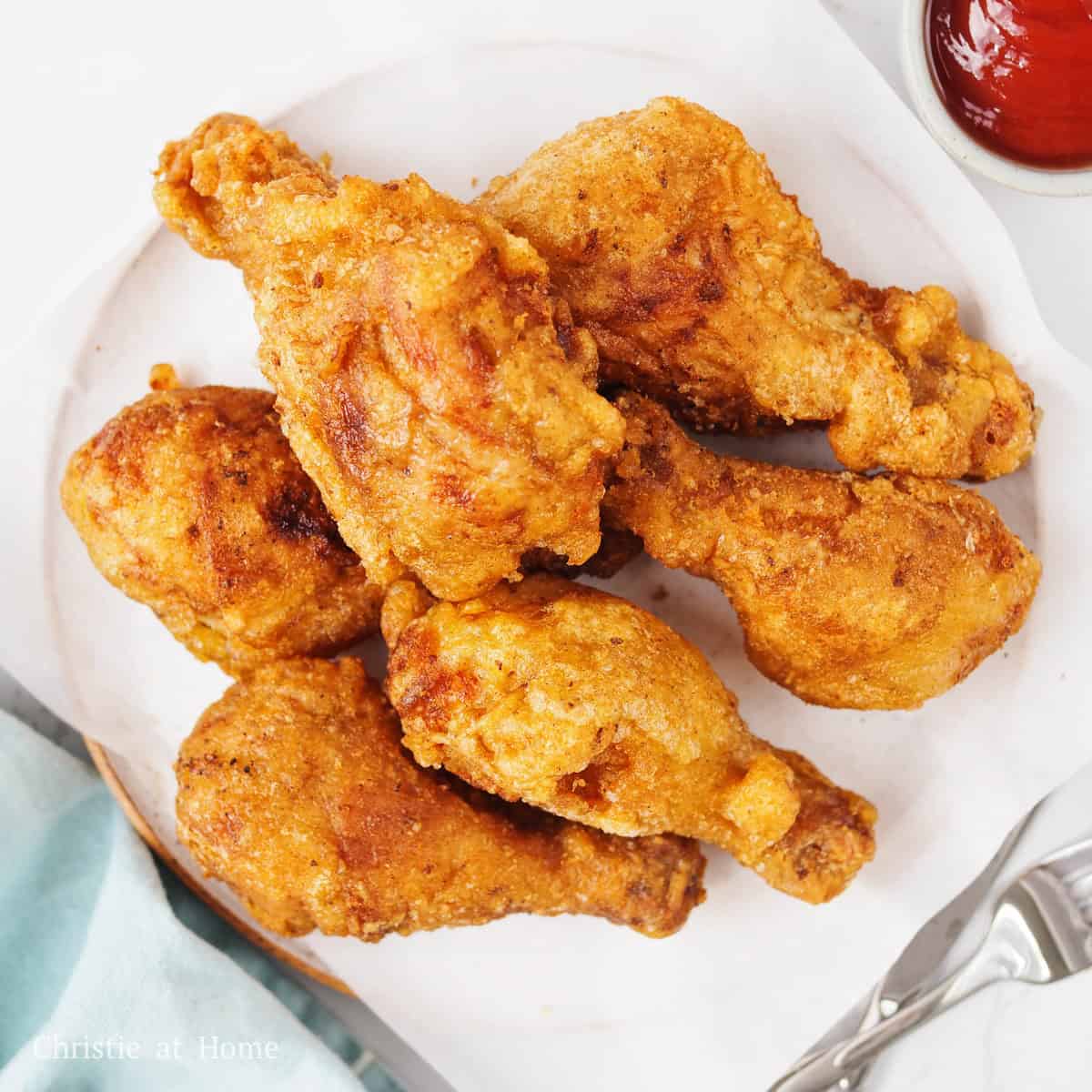Golden brown Korean fried chicken served on a plate.