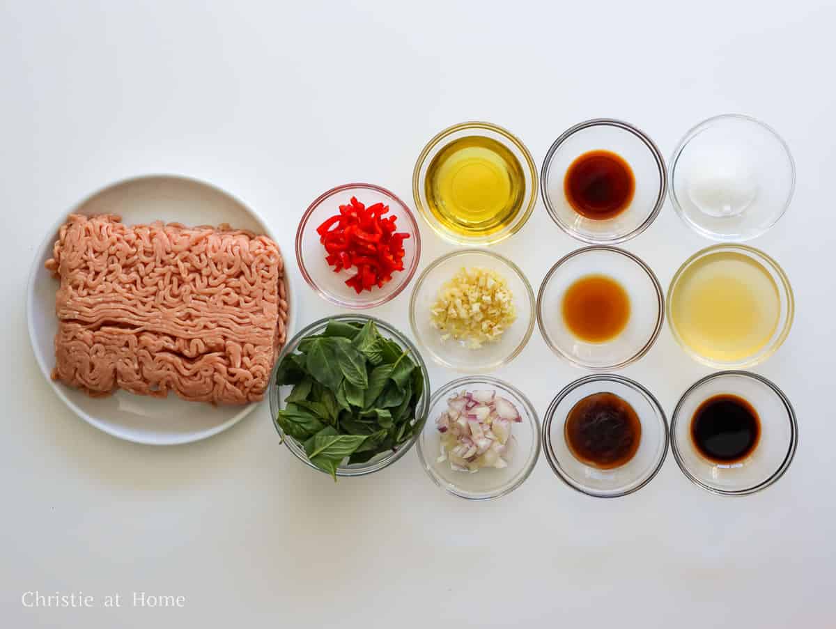 Ground chicken, holy basil, red chilies, garlic, shallot, chicken stock, vegetable oil, oyster sauce, fish sauce, soy sauces, and sugar for pad kra pao.