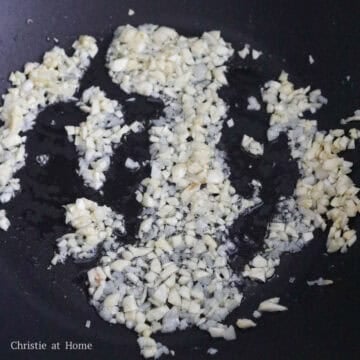 Minced garlic sizzling in hot oil