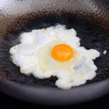 fry crispy egg and serve over fried rice